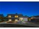 Modern home with landscaped yard at night at 108 Breeze Ct, Las Vegas, NV 89145