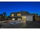 Modern home with landscaped yard at night at 108 Breeze Ct, Las Vegas, NV 89145