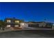 Modern home with landscaped yard at night at 108 Breeze Ct, Las Vegas, NV 89145