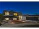 Modern home with landscaped yard at night at 108 Breeze Ct, Las Vegas, NV 89145