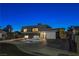 Modern home with landscaped yard at night at 108 Breeze Ct, Las Vegas, NV 89145