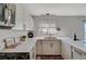 Modern kitchen with white cabinets, stainless steel appliances and a corner sink at 108 Breeze Ct, Las Vegas, NV 89145