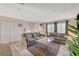 Open living room with sectional sofa and a view to the dining area at 108 Breeze Ct, Las Vegas, NV 89145