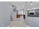 Bright entryway with wood-look floors and views into the living room and kitchen at 10810 Hunters Green Ave, Las Vegas, NV 89166