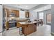 Kitchen with stainless steel appliances and an island at 10810 Hunters Green Ave, Las Vegas, NV 89166