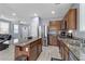 Modern kitchen with granite countertops and stainless steel appliances at 10810 Hunters Green Ave, Las Vegas, NV 89166