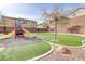 Modern playground with slides and play area at 10810 Hunters Green Ave, Las Vegas, NV 89166