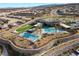 Aerial view of community with pool and surrounding homes at 11130 Red Yucca Dr, Las Vegas, NV 89138