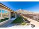 Backyard with grassy area, mountain views, and patio at 11130 Red Yucca Dr, Las Vegas, NV 89138