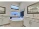 Luxurious bathroom with soaking tub and double vanity at 11130 Red Yucca Dr, Las Vegas, NV 89138