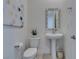 Clean and modern bathroom with pedestal sink and white toilet at 11130 Red Yucca Dr, Las Vegas, NV 89138