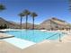 Inviting community pool with palm trees and mountain views at 11130 Red Yucca Dr, Las Vegas, NV 89138