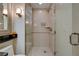 Contemporary bathroom with a walk-in shower and stylish vanity at 125 E Harmon Ave # 3214, Las Vegas, NV 89109