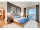 Spacious main bedroom with a large bed, city views, and stylish decor at 125 E Harmon Ave # 3214, Las Vegas, NV 89109