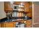 Sleek kitchen with stainless steel appliances and dark wood cabinetry at 125 E Harmon Ave # 3214, Las Vegas, NV 89109