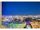 Night view of illuminated golf course and city skyline at 145 E Harmon Ave # 2120, Las Vegas, NV 89109