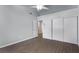 Bedroom with vaulted ceiling, ceiling fan, and grey wood-look flooring at 1911 Hobson Dr, Henderson, NV 89074