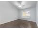 Bedroom with vaulted ceiling, ceiling fan, and grey wood-look flooring at 1911 Hobson Dr, Henderson, NV 89074