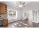 Eat-in kitchen with wood cabinets, granite countertop and view to living room at 1911 Hobson Dr, Henderson, NV 89074