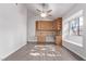 Cozy kitchenette with wood cabinets, granite countertop, and built-in desk at 1911 Hobson Dr, Henderson, NV 89074