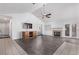 Spacious living room featuring hardwood floors, a fireplace, and high ceilings at 1911 Hobson Dr, Henderson, NV 89074