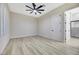 Bright bedroom featuring wood-look floors and a ceiling fan at 1928 Oliver Springs St, Henderson, NV 89052