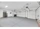 Spacious two-car garage with epoxy flooring and ample storage at 1928 Oliver Springs St, Henderson, NV 89052