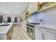 Modern kitchen with stainless steel appliances and light wood cabinets at 1928 Oliver Springs St, Henderson, NV 89052