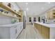 Modern kitchen with white cabinets, quartz countertops, and stainless steel appliances at 1928 Oliver Springs St, Henderson, NV 89052