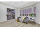 Relaxing living area featuring a daybed and sliding glass doors to a patio with scenic views at 1928 Oliver Springs St, Henderson, NV 89052