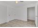 Simple bedroom with tile floors and mirrored closet doors at 1955 Cutlass Dr # 1955, Henderson, NV 89014