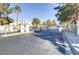 Gated community entrance with palm trees and well-maintained landscaping at 1955 Cutlass Dr # 1955, Henderson, NV 89014