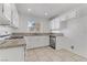 Efficient kitchen with white cabinets and granite countertops at 1955 Cutlass Dr # 1955, Henderson, NV 89014