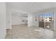 Open living space with tile floors and views of the kitchen at 1955 Cutlass Dr # 1955, Henderson, NV 89014