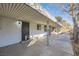 Covered patio with concrete flooring and wrought iron gate at 200 Rancho Vista Dr, Las Vegas, NV 89106