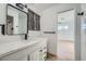 Modern bathroom with white vanity, black matte fixtures and a walk-in shower at 200 Rancho Vista Dr, Las Vegas, NV 89106