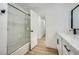 Bathroom with a bathtub and glass sliding door at 200 Rancho Vista Dr, Las Vegas, NV 89106