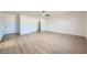 Large bedroom with light walls, ceiling fan and wood-look floors at 200 Rancho Vista Dr, Las Vegas, NV 89106