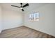 Simple bedroom with hardwood floors and a ceiling fan at 200 Rancho Vista Dr, Las Vegas, NV 89106