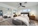 Virtually staged bedroom with gray bedding and mirrored closet doors at 200 Rancho Vista Dr, Las Vegas, NV 89106