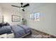 Virtually staged bedroom with a ceiling fan and window at 200 Rancho Vista Dr, Las Vegas, NV 89106