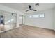 Bright bedroom with mirrored closet doors and wood-look floors at 200 Rancho Vista Dr, Las Vegas, NV 89106