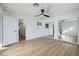 Light and airy bedroom with mirrored closet doors and ceiling fan at 200 Rancho Vista Dr, Las Vegas, NV 89106