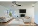 Virtually staged living room featuring a fireplace and light wood floors at 200 Rancho Vista Dr, Las Vegas, NV 89106