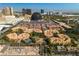 Aerial view of community, pool, and city skyline at 230 E Flamingo Rd # 334, Las Vegas, NV 89169