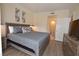 King size bed, dresser, TV and sliding door to balcony at 230 E Flamingo Rd # 334, Las Vegas, NV 89169