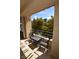 Private patio with seating area and treetop views at 230 E Flamingo Rd # 334, Las Vegas, NV 89169