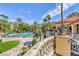 Resort-style pool with lush landscaping and balcony views at 230 E Flamingo Rd # 334, Las Vegas, NV 89169