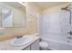 Clean bathroom with a tub shower, vanity, and shelving at 2422 Paradise Village Way, Las Vegas, NV 89104