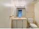 Clean bathroom with vanity, toilet and mirror at 2422 Paradise Village Way, Las Vegas, NV 89104